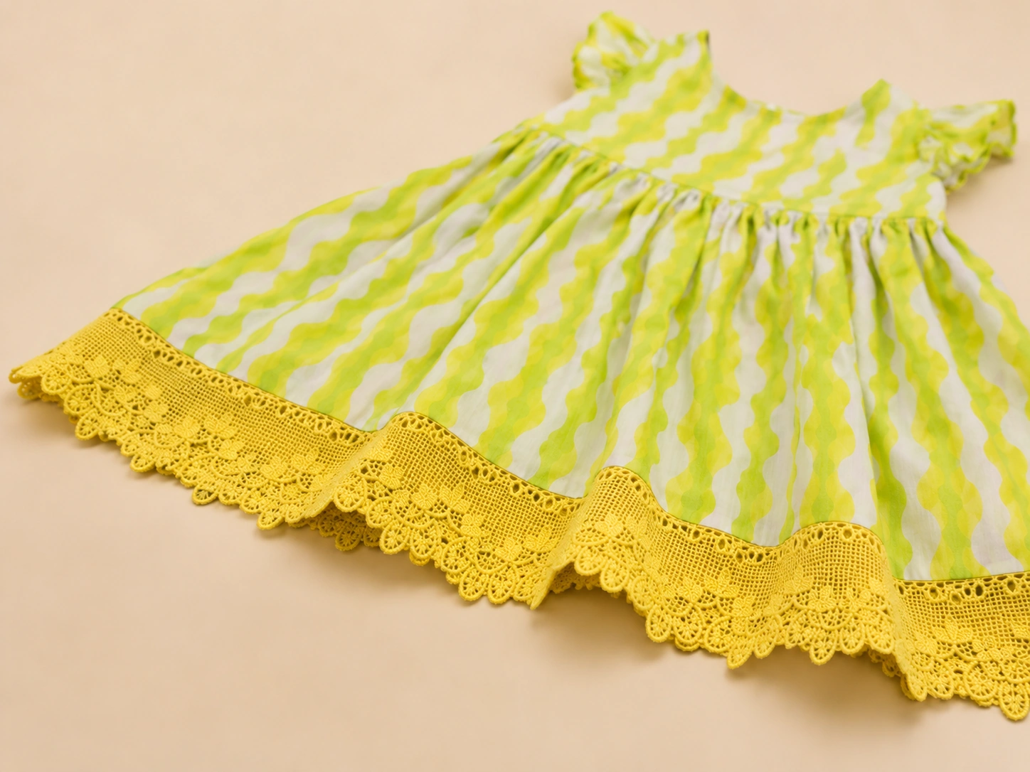 Close-up of ruffle sleeve and yellow crochet lace
