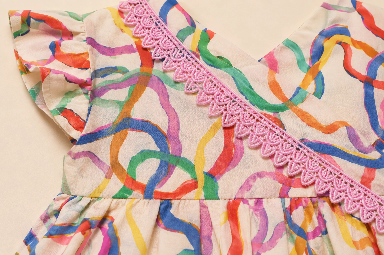 Pink scalloped lace trim detail