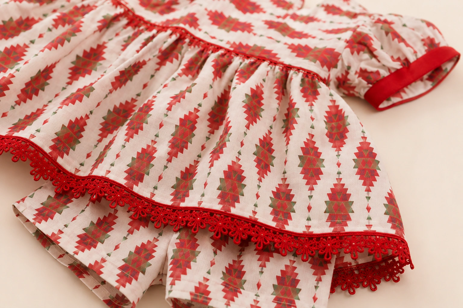 Close-up of red crochet lace and kilim print